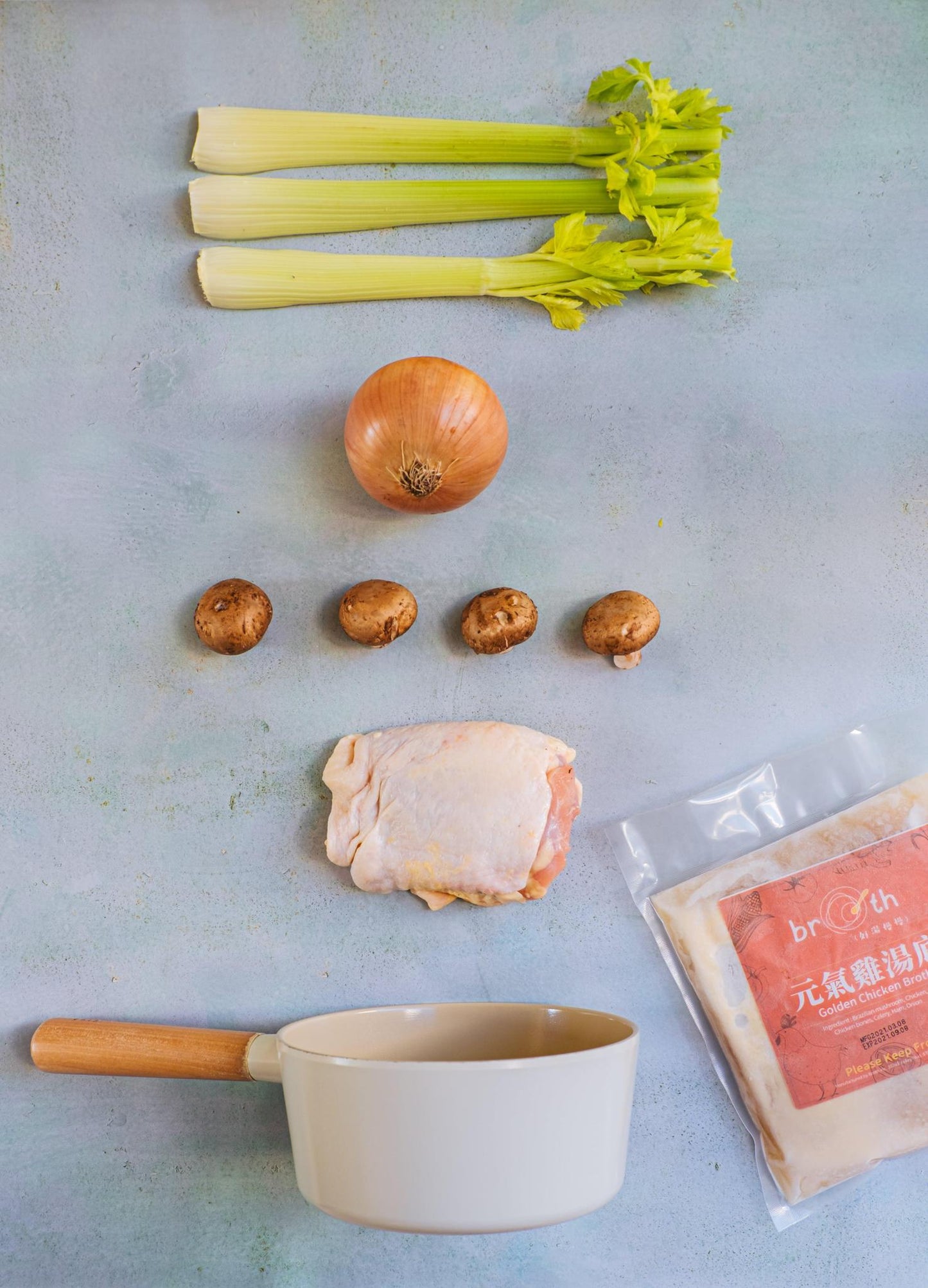 golden chicken broth with veggies