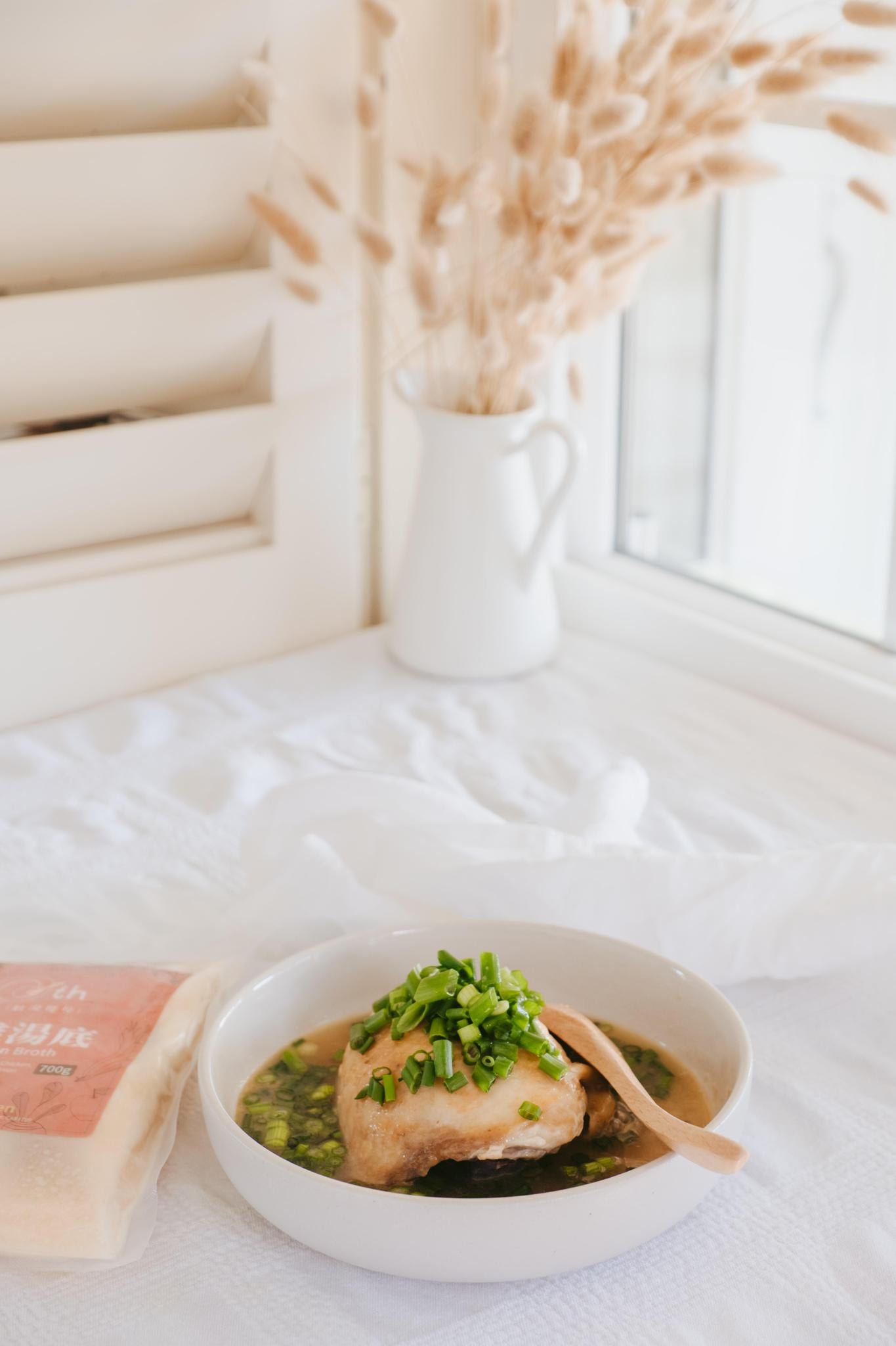 golden chicken broth display