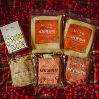 Packaged food items on a red plaid background with red berries